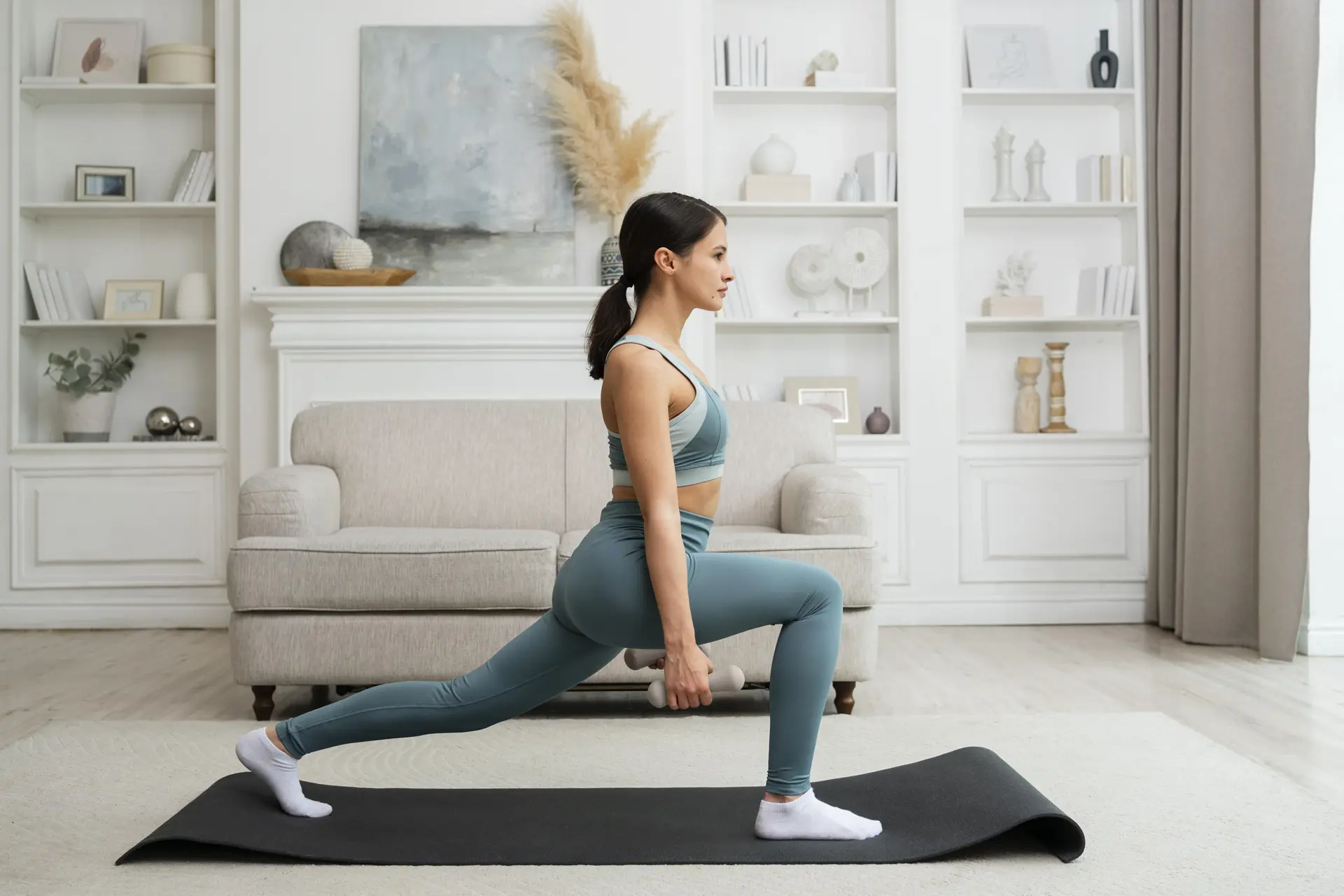 Woman performing a fitness workout using props and exercise equipment to improve strength, balance and flexibility